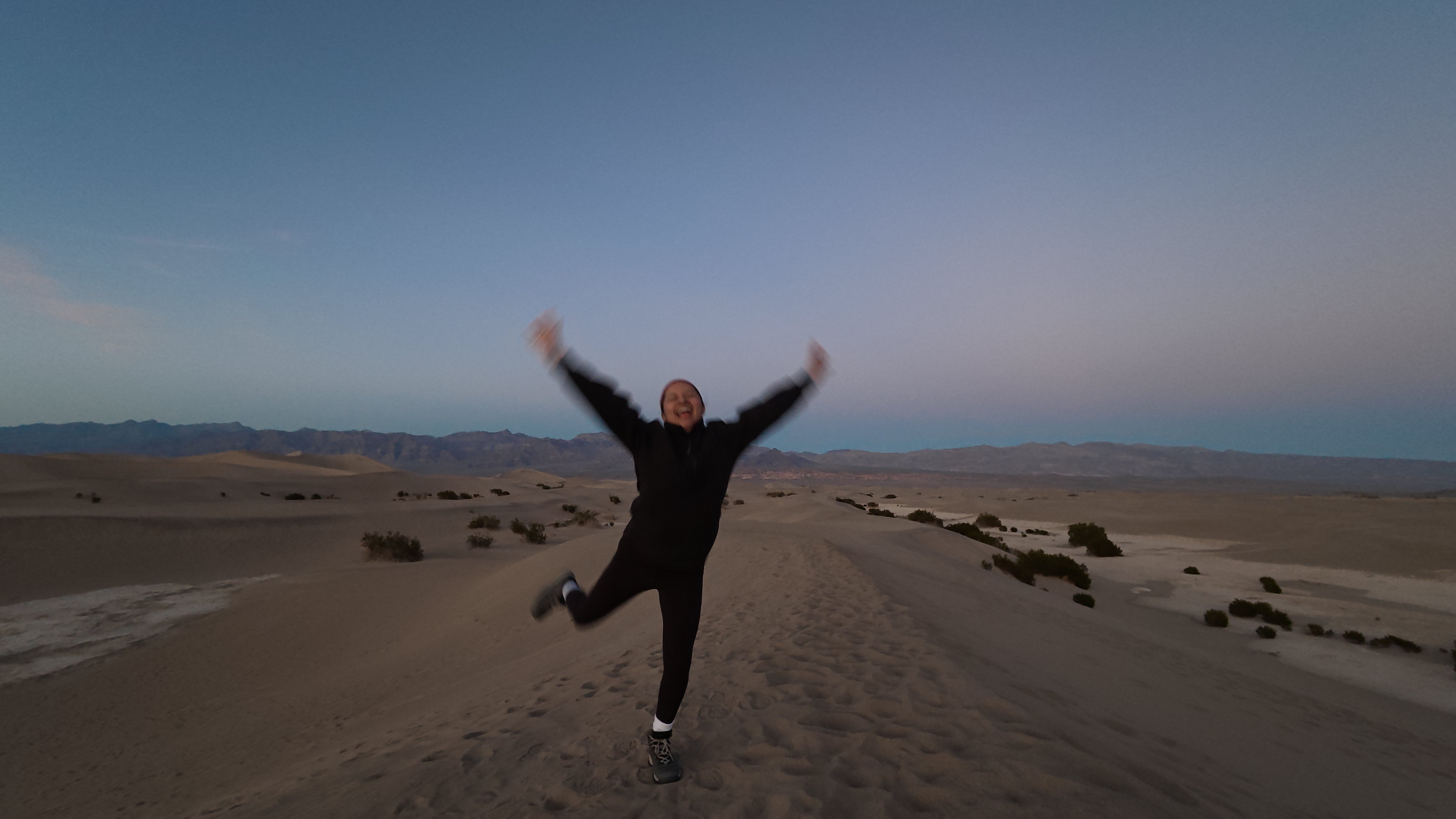 Tiffany jumping in the dunes