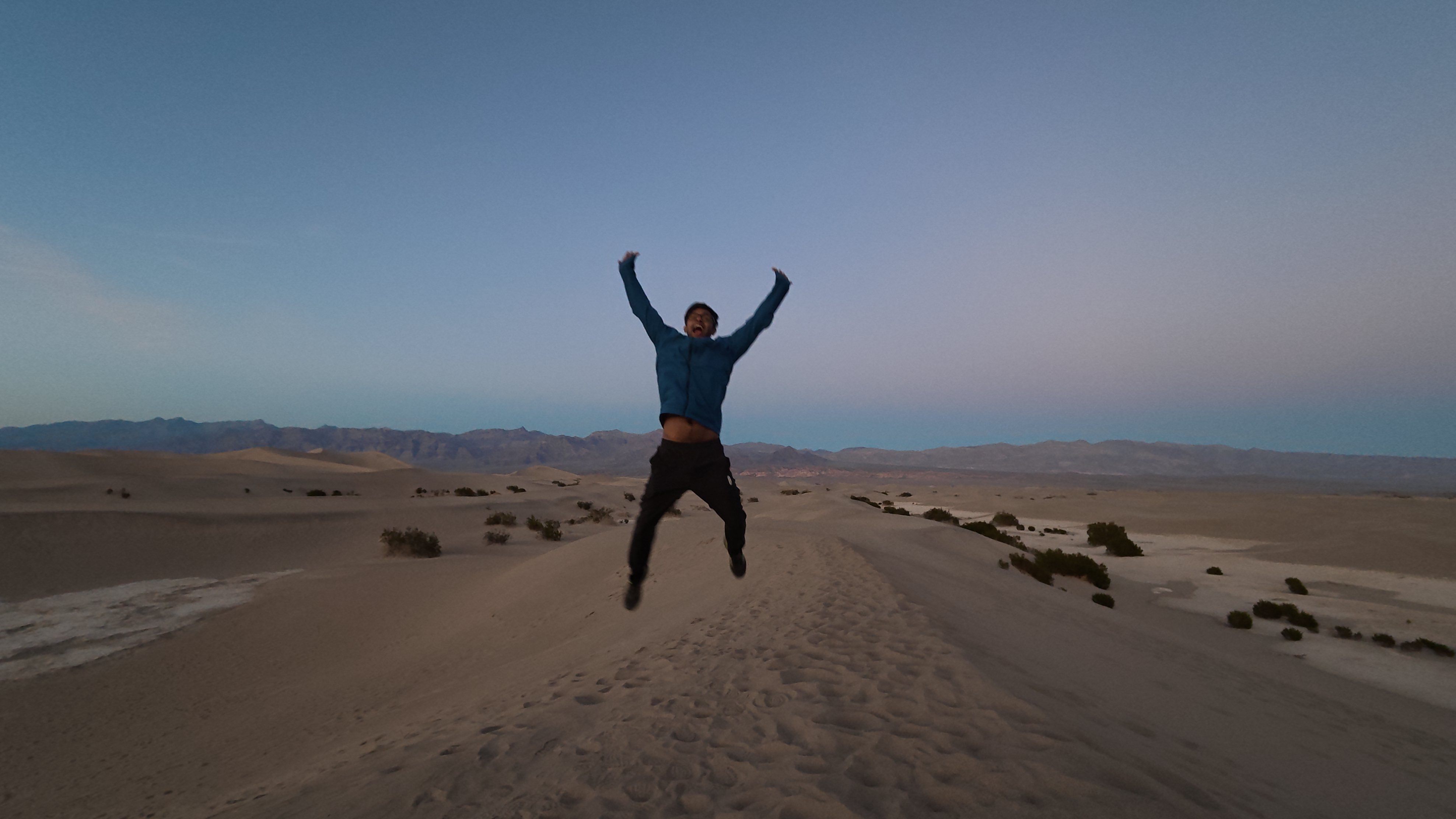 Aravind jumping in the dunes